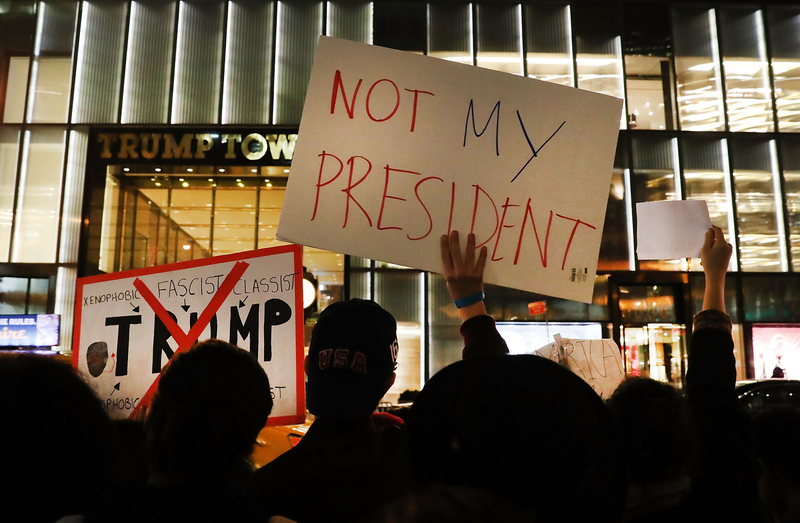 Dozens of anti-Donald Trump protesters stand along Fifth Avenue in New York City in front of Trump Tower on Nov. 10, 2016, in response to the election of Trump as president of the United States.Spencer Platt/Getty Images